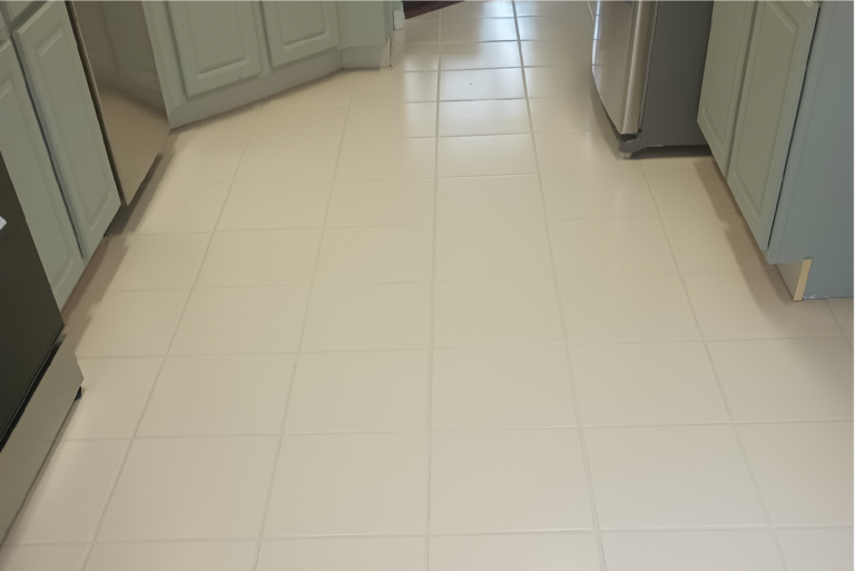 Clean kitchen tile floor with restored grout after professional cleaning in Port Charlotte Florida