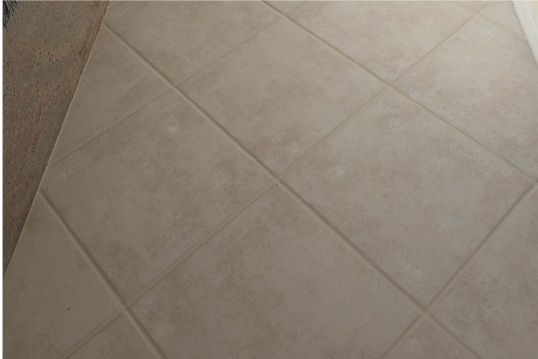 Clean living room tile floor with restored grout after professional cleaning in Port Charlotte Florida